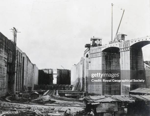 The exit from one side, the first pair of gates to be placed in position, Panama, circa 1912.