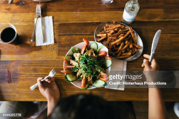 aerial view of salad and fries - vegetarisch stock-fotos und bilder