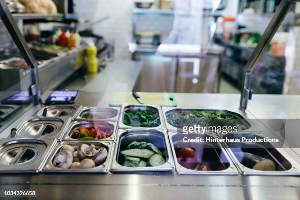 salad and vegetables in steel containers - cafeteria stock pictures, royalty-free photos & images
