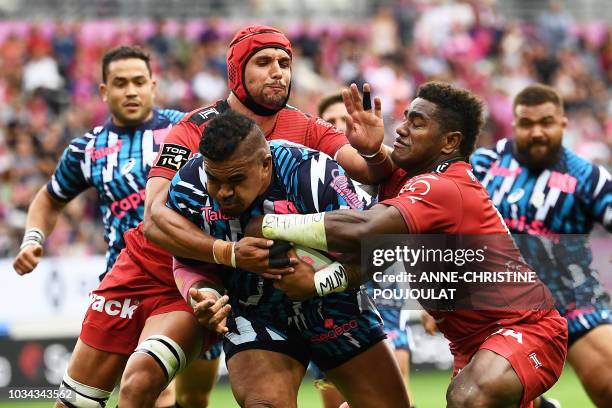 Stade Francais Paris' Siegfried Fisiihoi vies with RC Toulon's South African lock Juandre Kruger during the French Top 14 rugby union match between...