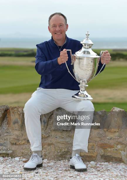 Gary Orr of Scotland poses with the trophy as he wins the Scottish Senior Open during Day Three of the Scottish Senior Open at Craigielaw Golf Club...