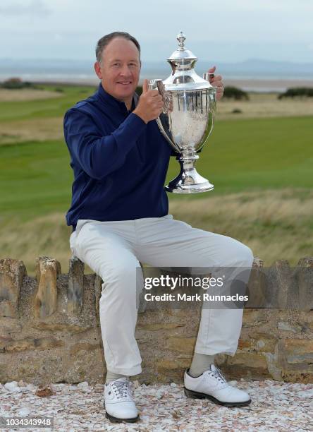 Gary Orr of Scotland poses with the trophy as he wins the Scottish Senior Open during Day Three of the Scottish Senior Open at Craigielaw Golf Club...