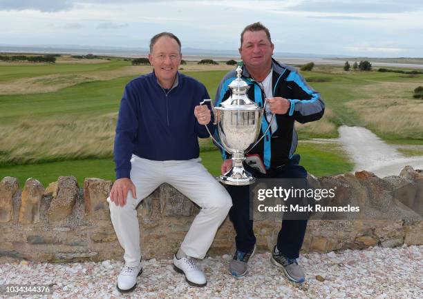 Gary Orr of Scotland poses with the trophy and his caddie "Mucker", as he wins the Scottish Senior Open during Day Three of the Scottish Senior Open...