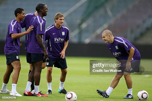 Curtis Davies, Isaiah Osbourne, Marc Albrighton and James Collins Jr of Aston Villa take part in a training session ahead of their UEFA Europa League...