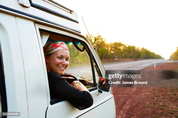 female driver and highway - northern territory stock-fotos und bilder