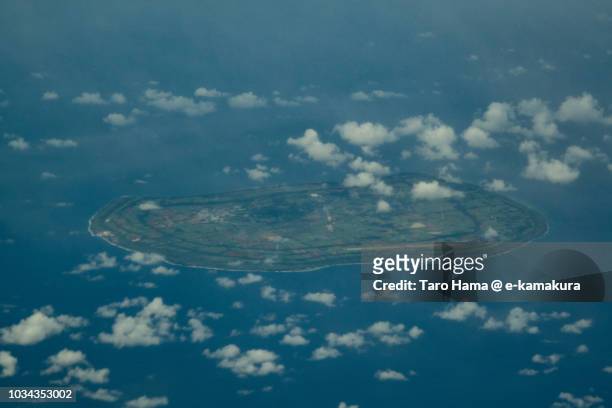 pacific ocean and minami daito island in okinawa prefecture in japan daytime aerial view from airplane - list of islands by highest point stock pictures, royalty-free photos & images