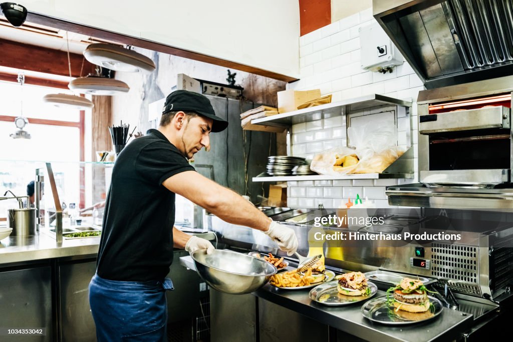 Chef Preparing Food For Customers