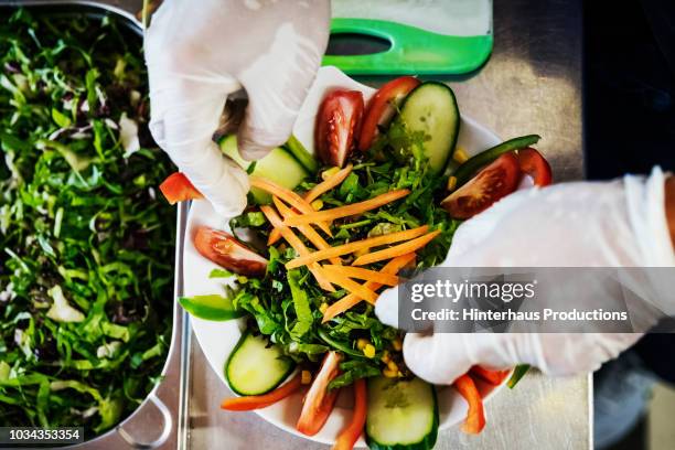 chef preparing salad for customers - food safety gloves stock pictures, royalty-free photos & images