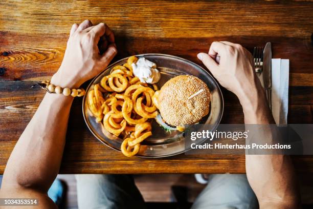 aerial shot of customers burger - french fries overhead stock pictures, royalty-free photos & images