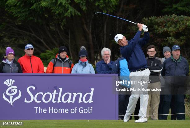 Gary Orr of Scotland plays his tee shot at the 18th hole during Day Three of the Scottish Senior Open at Craigielaw Golf Club on September 16, 2018...