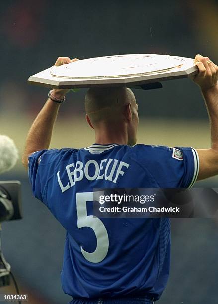 Frank Leboeuf of Chelsea holds the trophy after the Charity Shield against Manchester United at Wembley Stadium in London. Chelsea won the match 2-0....