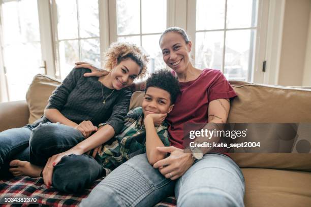 health insurance for the family - lesbian mom stock pictures, royalty-free photos & images