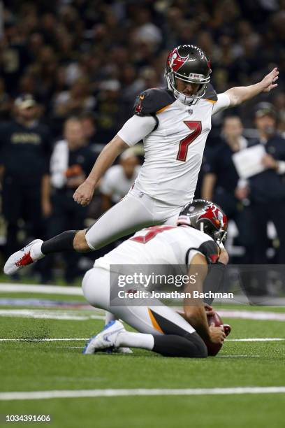 Chandler Catanzaro of the Tampa Bay Buccaneers kicks the ball during a game against the New Orleans Saints at the Mercedes-Benz Superdome on...