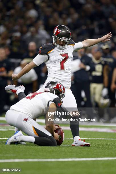 Chandler Catanzaro of the Tampa Bay Buccaneers kicks the ball during a game against the New Orleans Saints at the Mercedes-Benz Superdome on...