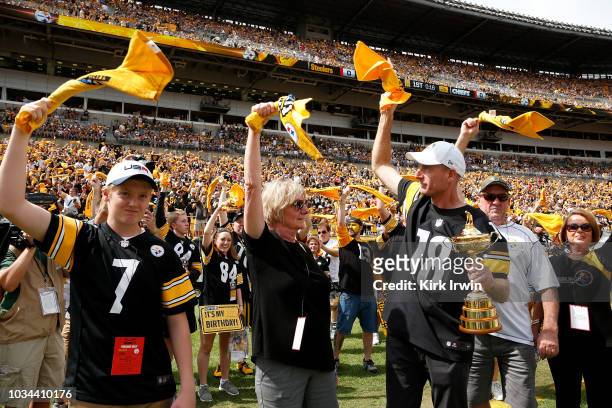 Ryder Cup Captain Jim Furyk leads fans in the Terrible Towel Twirl prior to the start of the game between the Pittsburgh Steelers and the Kansas City...