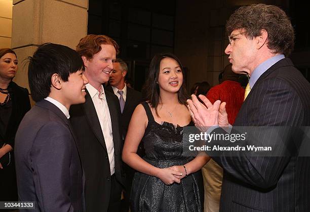 Bee Vang, Christopher Carley, Ahney Her and Alan Horn arrive on the red carpet for the Los Angeles premiere of "Gran Torino" at the Steven J. Ross...