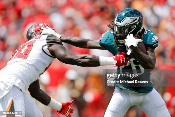 Jay Ajayi of the Philadelphia Eagles stiff arms Jason Pierre-Paul of the Tampa Bay Buccaneers during the first half at Raymond James Stadium on...