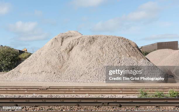 pile of aggregate in a yard - gravel stock pictures, royalty-free photos & images