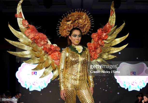 Models walk the runway for JAL Fashion on day 2 of the House of iKons show during London Fashion Week September 2018 at the Millennium Gloucester...