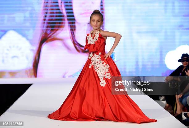 Models walk the runway for Korn Taylor on day 2 of the House of iKons show during London Fashion Week September 2018 at the Millennium Gloucester...