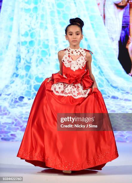 Models walk the runway for Korn Taylor on day 2 of the House of iKons show during London Fashion Week September 2018 at the Millennium Gloucester...