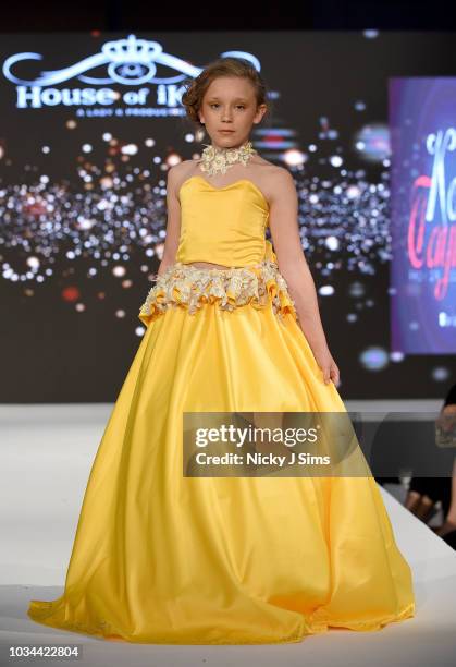 Models walk the runway for Korn Taylor on day 2 of the House of iKons show during London Fashion Week September 2018 at the Millennium Gloucester...