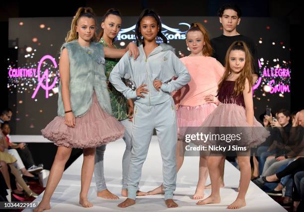 Models walk the runway for Courtney Allegra on day 2 of the House of iKons show during London Fashion Week September 2018 at the Millennium...