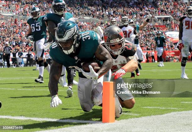 Corey Clement of the Philadelphia Eagles scores a touchdown during a game against the Tampa Bay Buccaneers at Raymond James Stadium on September 16,...