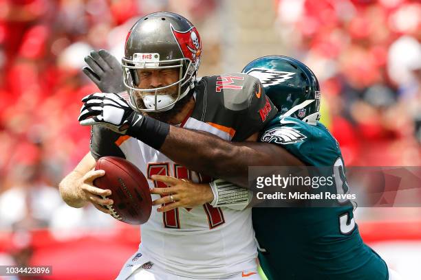 Fletcher Cox of the Philadelphia Eagles sacks Ryan Fitzpatrick of the Tampa Bay Buccaneers during the first half at Raymond James Stadium on...
