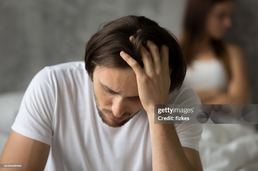 Close up of frustrated husband considering relationship problems