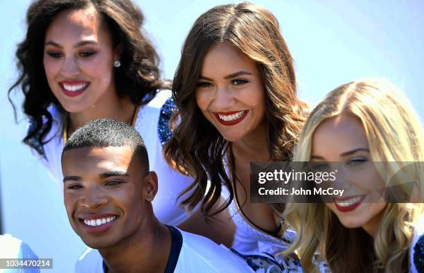 Napoleon Jinnes, one of the first male NFL cheerleaders, poses with his Los Angeles Rams Cheerleaders squad before the game against the Arizona...