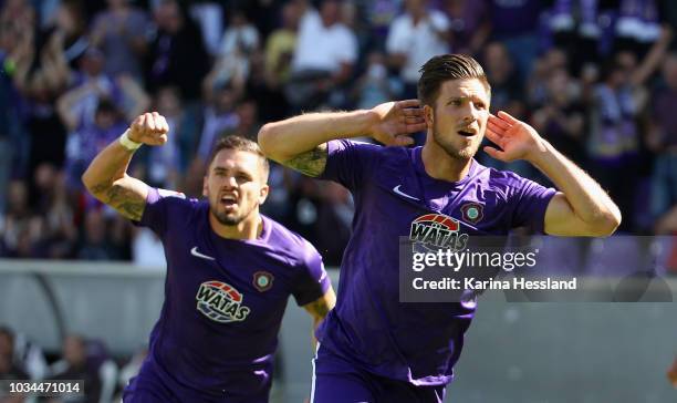 Pascal Testroet and Dennis Kempe of Aue celebrate the opening goal during the second Bundesliga match between FC Erzgebirge Aue and FC St.Pauli at...