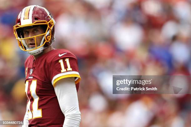 Quarterback Alex Smith of the Washington Redskins looks on against the Indianapolis Colts during the second half at FedExField on September 16, 2018...