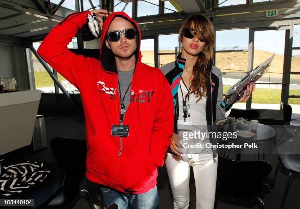 Actor Aaron Paul and Jacqueline Novak attend "Learn to Ride" with the Audi Sportscar Experience 2010, presented by Oakley at Infineon Raceway on May...