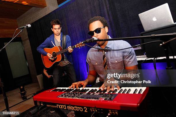Musicians Kelley James and James Kinney perform onstage during "Learn to Ride" with the Audi Sportscar Experience 2010, presented by Oakley at...