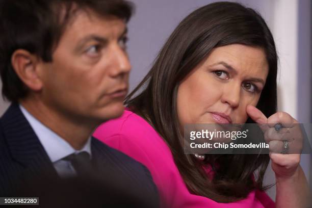 White House Press Secretary Sarah Huckabee Sanders listens to reporters ask questions during a news conference with Deputy Press Secretary Hogan...
