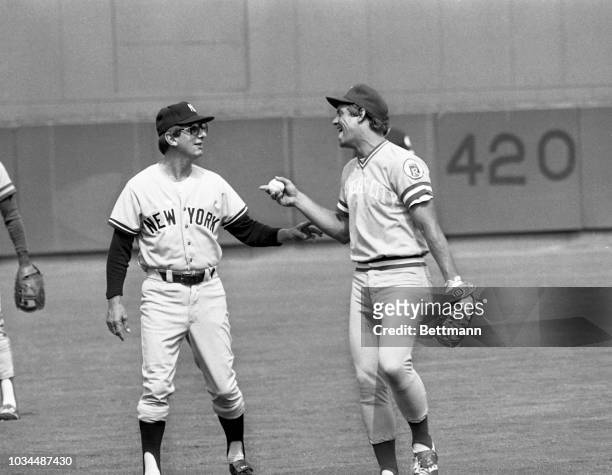 Billy Martin, manager of the New York Yankees and the manager of the American League All Stars, shares a joke with George Brett, third baseman, from...