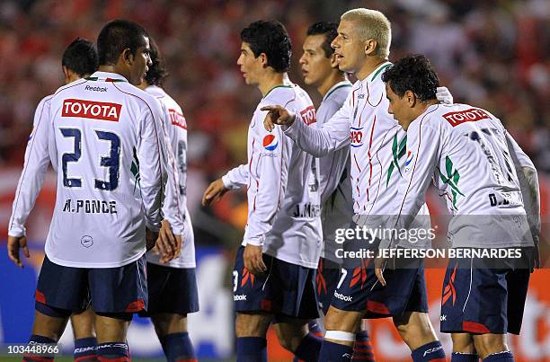 Mexico's Chivas players leave the field after their Libertadores final football match against Brazilian Internacional at Beira Rio stadium in Porto...