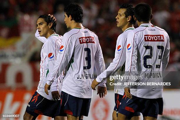 Mexico's Chivas players leave the field after their Libertadores final football match against Brazilian Internacional at Beira Rio stadium in Porto...