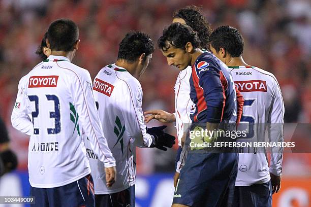 Mexico's Chivas players leave the field after their Libertadores final football match against Brazilian Internacional at Beira Rio stadium in Porto...