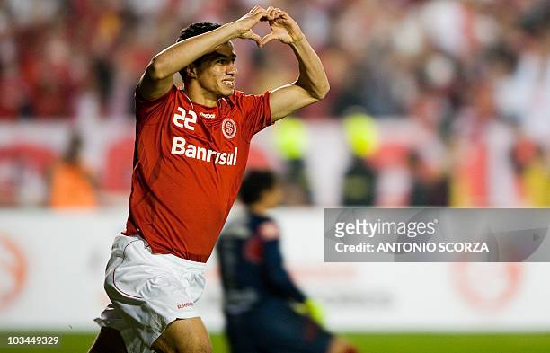 Brazil's Internacional soccer player Leandro Damiao celebrates his goal against Mexico's Chivas on August 18, 2010 during their Libertadores final...