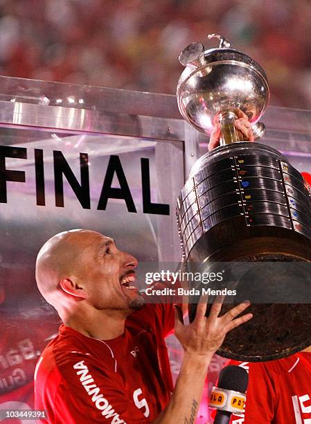 Guinazu of Internacional celebrates championship title after defeating Chivas during a final match as part of the 2010 Copa Santander Libertadores at...