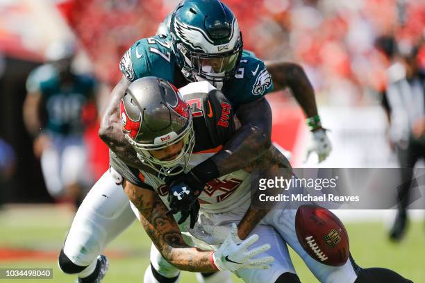 Malcolm Jenkins of the Philadelphia Eagles forces Mike Evans of the Tampa Bay Buccaneers to fumble during the second half at Raymond James Stadium on...