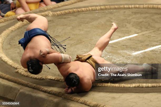 Kagayaki throws Chiyonokuni to win on day eight of the Grand Sumo Autumn Tournament at Ryogoku Kokugikan on September 16, 2018 in Tokyo, Japan.