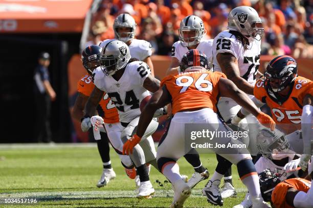 Marshawn Lynch of the Oakland Raiders rushes with the ball during the second quarter against the Denver Broncos. The Denver Broncos hosted the...