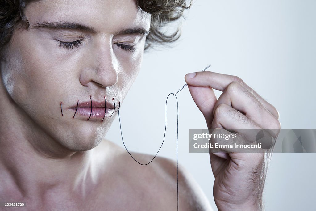 Threading Using Mouth Man Threading Mouth Closed High-Res Stock Photo - Getty Images