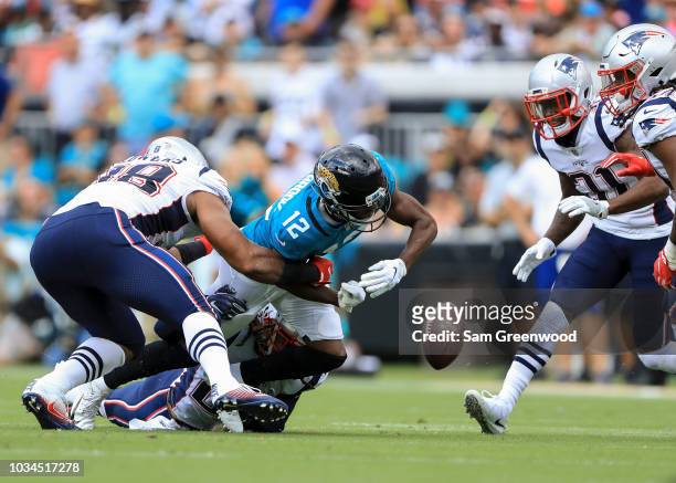 Dede Westbrook of the Jacksonville Jaguars fumbles the ball in the first half against the New England Patriots at TIAA Bank Field on September 16,...