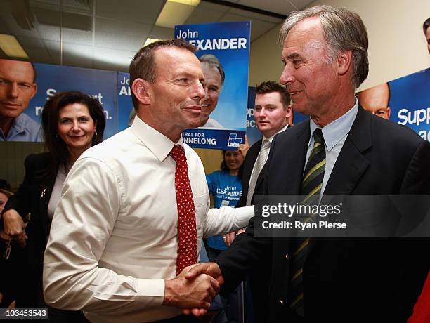 Opposition leader Tony Abbott shakes hands with John Alexander, Liberal candidate for Bennelong, during the final week of campaigning ahead of this...