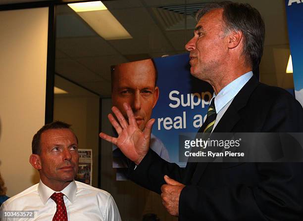 Opposition leader Tony Abbott listens as John Alexander, Liberal candidate for Bennelong, talks during the final week of campaigning ahead of this...