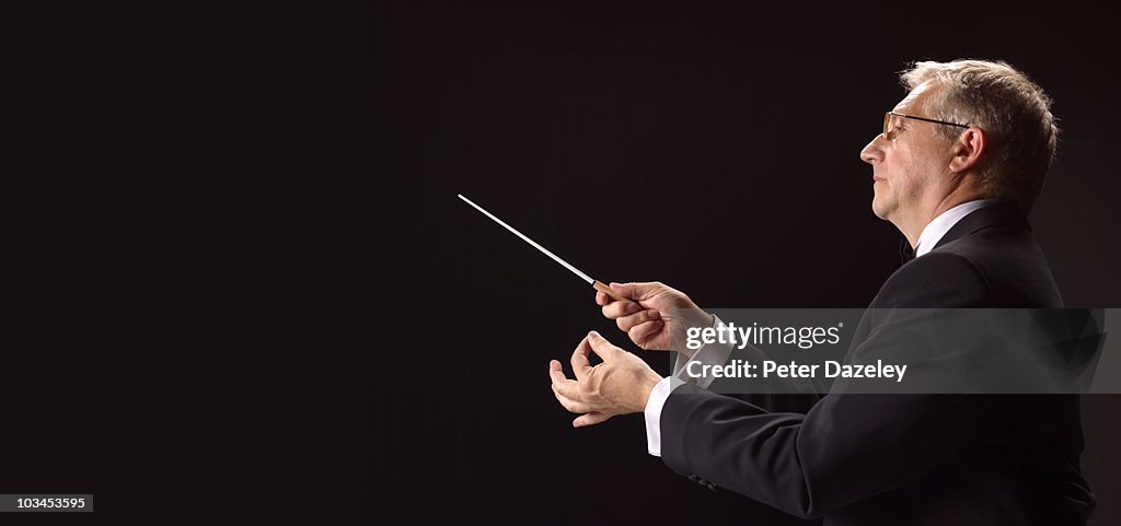 Conductor conducting classical music